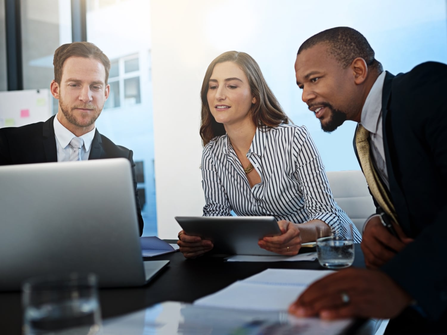 contract attorneys reviewing documents on laptop