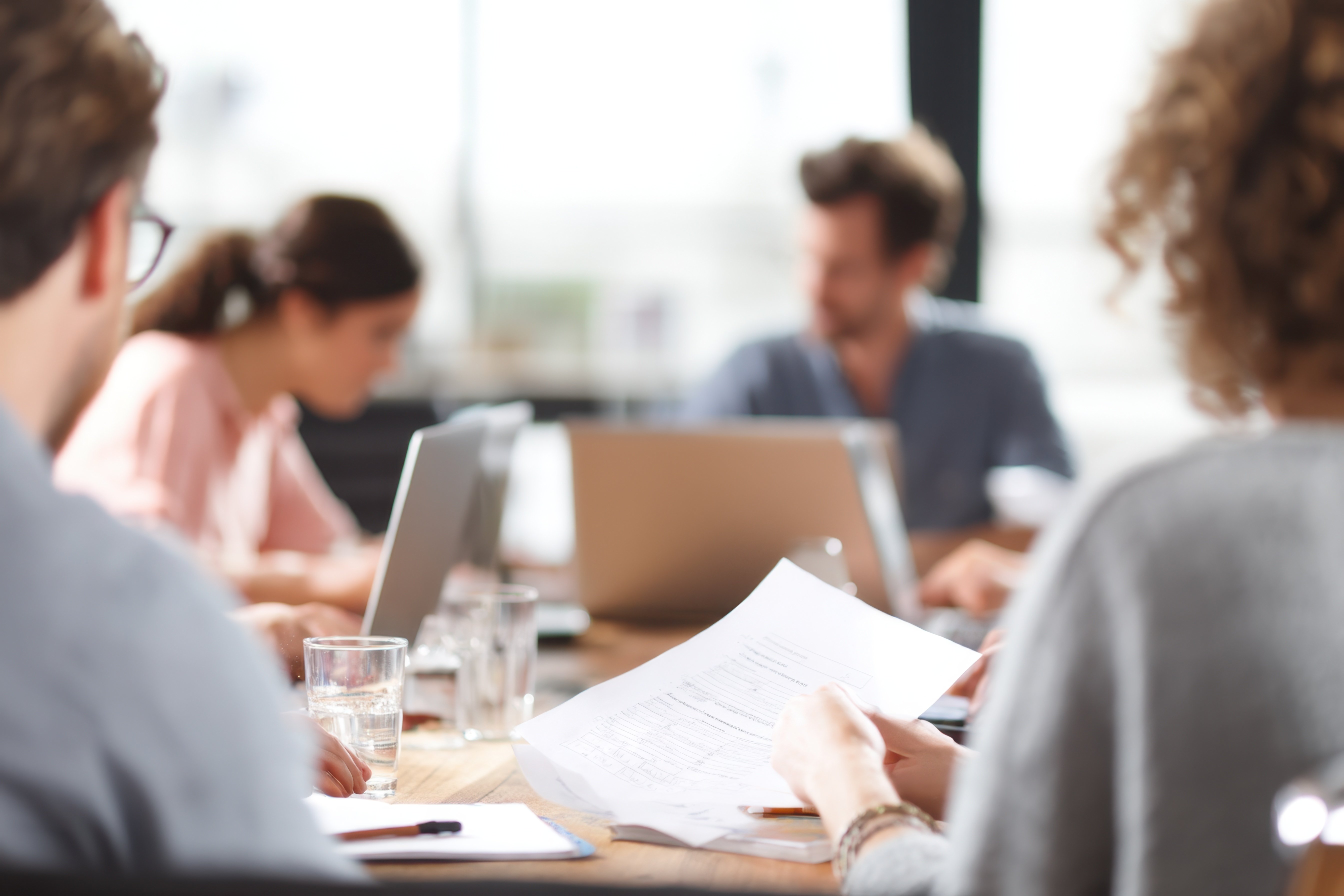 legal team in a meeting with laptops